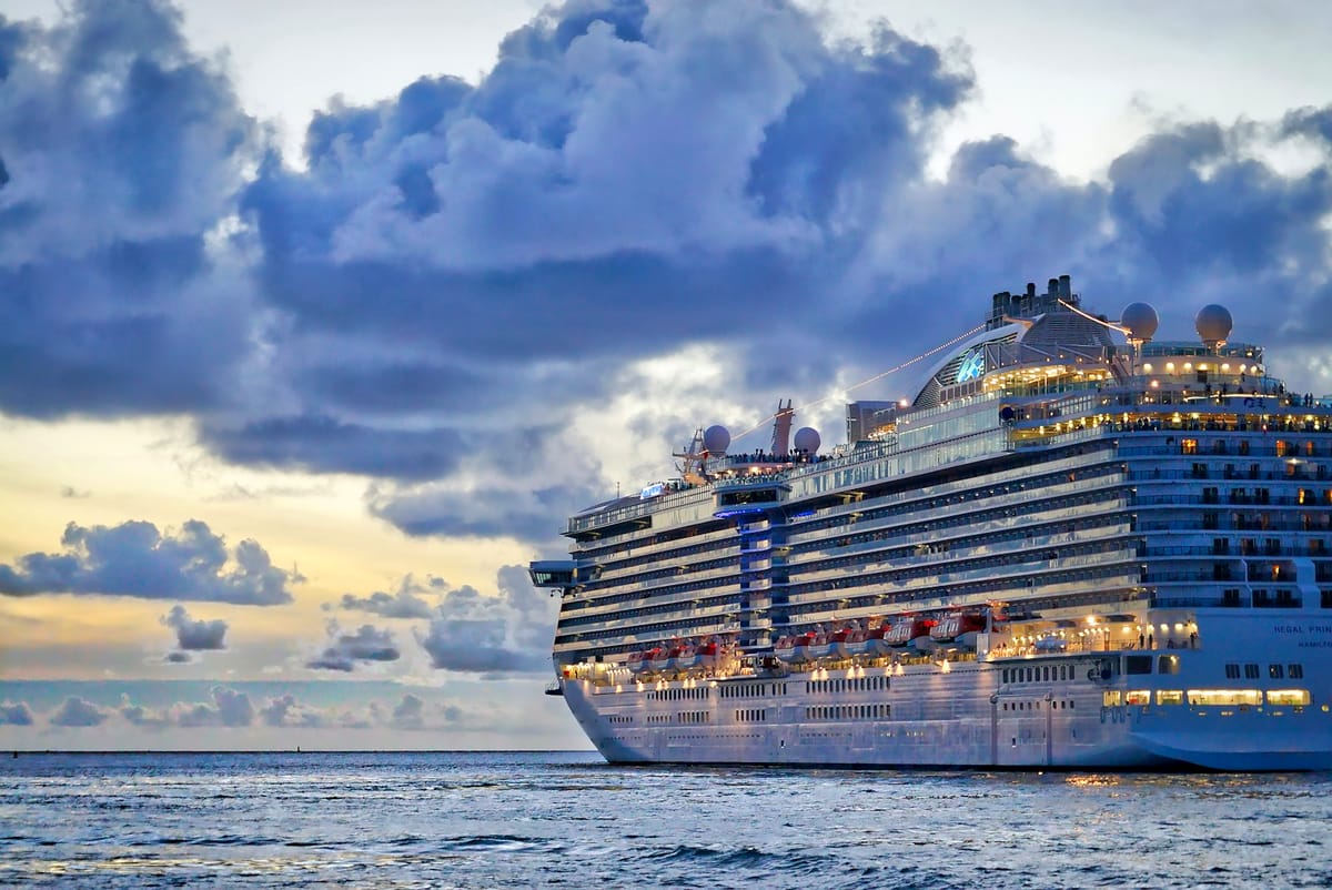 Cruise ship at sea during sunset